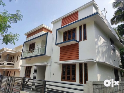 A SUPERB NEW 4BED ROOM 1700SQ FT HOUSE IN OLLUR,THRISSUR