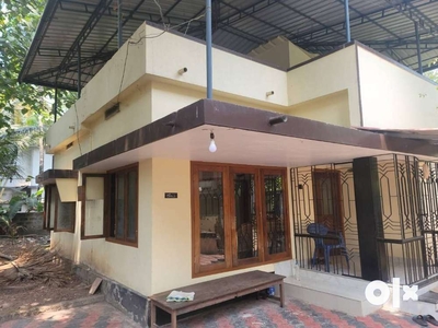One storey house built in 7.5 cents plot with coconut and mango trees