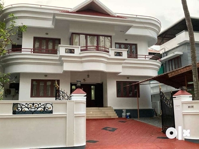 Elegant Two-Story Residence on 8.33 Cents in the Esteemed Alukkas G