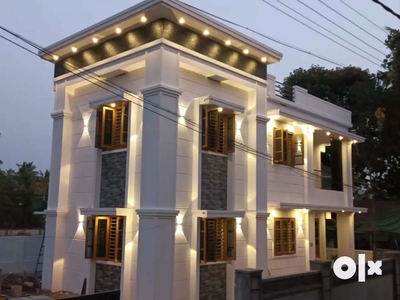 AN ELEGANT NEW 4BED ROOM 1850SQ FT 5.7CENT HOUSE IN KOLAZHY,THRISSUR