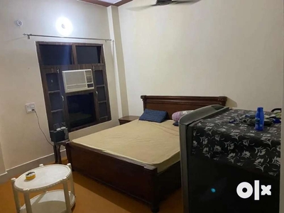 Ac furnished room with kitchen bed fridge ro almirah sofa car parking