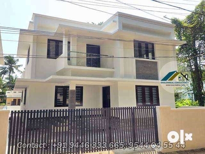 A two-story home at East Hill Cherukulam Kottooli Kunduparamba